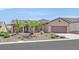 Charming single-story home featuring desert landscaping, tile roof, and attached two-car garage at 2156 Shadow Canyon Dr, Henderson, NV 89044