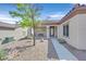 Inviting front yard with desert landscaping, walkway leading to the front door, and cozy bench at 2156 Shadow Canyon Dr, Henderson, NV 89044