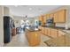 Bright kitchen with granite countertops, an island, stainless steel appliances, and tile flooring at 2156 Shadow Canyon Dr, Henderson, NV 89044