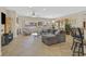 Spacious living room with tile flooring, fireplace, large windows, and comfortable seating arrangement at 2156 Shadow Canyon Dr, Henderson, NV 89044