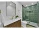 Contemporary bathroom featuring a rainfall shower and a modern vanity with green tile at 2160 Pueblo Cir, Las Vegas, NV 89169