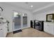 Bright laundry room boasts modern washer and dryer units and French doors leading to the backyard at 2160 Pueblo Cir, Las Vegas, NV 89169