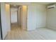 Bedroom with light hardwood floors, access to the bathroom and ensuite features at 220 N David St, Pahrump, NV 89060