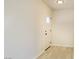 Bright entryway featuring neutral walls, light floors and a door with glass window at 220 N David St, Pahrump, NV 89060