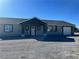 Charming single-story home featuring a gray exterior and a well-maintained front yard at 220 N David St, Pahrump, NV 89060