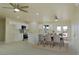 Bright open-concept kitchen with a dining table, stainless steel appliances, and a central island at 220 N David St, Pahrump, NV 89060