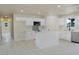 Open concept kitchen with an island, stainless steel appliances, and ample counter space at 220 N David St, Pahrump, NV 89060