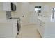 Well-lit kitchen features stainless steel appliances, white cabinets, and modern countertops at 220 N David St, Pahrump, NV 89060