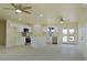 Bright open-concept kitchen featuring stainless steel appliances and a central island with quartz countertops at 220 N David St, Pahrump, NV 89060