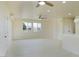Open-concept living room with bright windows and neutral walls provides a calming space at 220 N David St, Pahrump, NV 89060