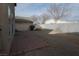 Spacious backyard area with a stone-paved patio and a picnic table at 2520 Living Rock St, Las Vegas, NV 89106