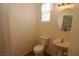 Bathroom with toilet and pedestal sink at 2520 Living Rock St, Las Vegas, NV 89106
