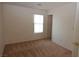 Bright, carpeted bedroom with a window and a closet, providing a cozy and private space for relaxation at 2520 Living Rock St, Las Vegas, NV 89106