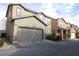 Two-story home featuring a two-car garage, tile roof, and low-maintenance landscaping at 2520 Living Rock St, Las Vegas, NV 89106
