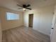 Cozy bedroom featuring wood-look flooring, closet, and a ceiling fan for added comfort at 2820 Richfield Blvd, Las Vegas, NV 89102