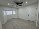 The bedroom offers a ceiling fan, wood-look floors, and a bay window at 2820 Richfield Blvd, Las Vegas, NV 89102