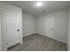This is a bedroom with wood-look floors and two doors inside of it at 2820 Richfield Blvd, Las Vegas, NV 89102