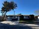 Charming single-story home with well-maintained front yard and mature tree on a sunny day at 2820 Richfield Blvd, Las Vegas, NV 89102