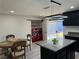 Open-concept kitchen area with modern island, stainless appliances, and convenient laundry machines at 2820 Richfield Blvd, Las Vegas, NV 89102