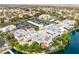 Stunning aerial view of office park nestled on a lake with lush tropical landscaping and surface parking at 2908 Reef Bay Ln, Las Vegas, NV 89128