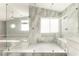 Bright bathroom with a glass shower, window, and built-in seat at 2908 Reef Bay Ln, Las Vegas, NV 89128