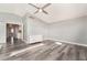 This bedroom is a spacious blank canvas with wood-look floors and lots of natural light at 2908 Reef Bay Ln, Las Vegas, NV 89128