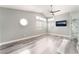 This large bedroom has an ensuite bathroom, high ceilings, wood-look floors, and lots of light at 2908 Reef Bay Ln, Las Vegas, NV 89128