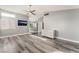 This bedroom features wood-look floors, and is adjacent to the bathroom at 2908 Reef Bay Ln, Las Vegas, NV 89128