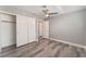 This bedroom features gray floors, neutral walls, a ceiling fan, and a closet at 2908 Reef Bay Ln, Las Vegas, NV 89128