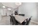 Elegant dining room with vaulted ceiling, modern chandelier, and neutral colors at 2908 Reef Bay Ln, Las Vegas, NV 89128