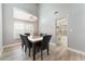 Spacious dining room features a large window and flows into an open-concept living area at 2908 Reef Bay Ln, Las Vegas, NV 89128