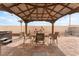 The home contains a gazebo with a dining table and hot tub at 2908 Reef Bay Ln, Las Vegas, NV 89128