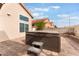 Backyard view showcasing a private hot tub with a brick paver patio, offering an inviting outdoor retreat at 2908 Reef Bay Ln, Las Vegas, NV 89128