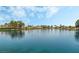 Scenic lake view with calm waters and distant homes, a serene natural amenity for residents to enjoy at 2908 Reef Bay Ln, Las Vegas, NV 89128