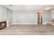 Spacious living room showcasing fireplace, hardwood floors, and neutral paint, creating a cozy atmosphere at 2908 Reef Bay Ln, Las Vegas, NV 89128
