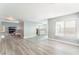 Expansive living space with hardwood floors, seamlessly connecting living, dining, and kitchen areas at 2908 Reef Bay Ln, Las Vegas, NV 89128
