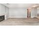 Spacious living room showcasing fireplace, hardwood floors, and neutral paint, creating a cozy atmosphere at 2908 Reef Bay Ln, Las Vegas, NV 89128