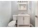 Updated half bathroom includes a modern vanity with storage and stylish fixtures at 2908 Reef Bay Ln, Las Vegas, NV 89128