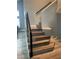 Wood staircase features stylish railings, complemented by modern paint and flooring, enhances the home's interior design at 2908 Reef Bay Ln, Las Vegas, NV 89128
