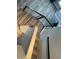Overhead view of staircase with modern railing and wood steps, transitioning into a carpeted area with stylish decor at 2908 Reef Bay Ln, Las Vegas, NV 89128