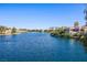 Beautiful waterfront property featuring stunning lake views with lakeside homes and lush landscaping at 2908 Reef Bay Ln, Las Vegas, NV 89128