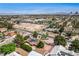 Wide aerial view of a residential area showcasing homes with solar panels and lush landscaping at 3015 Duneville St, Las Vegas, NV 89146