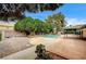 Expansive backyard showcases a pool, spa, mature trees, and a covered patio perfect for outdoor living at 3015 Duneville St, Las Vegas, NV 89146
