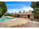A backyard paradise with a pool, spa, covered patio, and solar panels for energy efficiency at 3015 Duneville St, Las Vegas, NV 89146