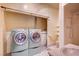 Full bathroom with laundry area, including washer and dryer at 3015 Duneville St, Las Vegas, NV 89146