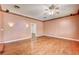 Empty bedroom featuring hardwood floors, crown molding and ample natural light from windows at 3015 Duneville St, Las Vegas, NV 89146