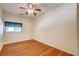 Comfortable bedroom featuring wood floors and a ceiling fan at 3015 Duneville St, Las Vegas, NV 89146