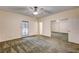 Comfortable bedroom with carpet, ceiling fan, and sliding mirror closet doors at 3015 Duneville St, Las Vegas, NV 89146