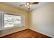 Cozy bedroom with wood floors and window with neighborhood view at 3015 Duneville St, Las Vegas, NV 89146