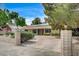 Long driveway leading to a beautiful home, framed by decorative brick pillars at 3015 Duneville St, Las Vegas, NV 89146